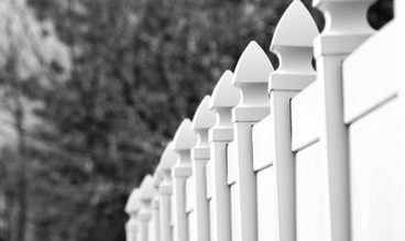 white vinyl fence with posts